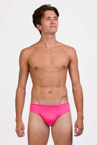 Male model wearing the Men's Brolyn Swim Brief in the Pink Prism solid, standing in front of a grey background shown from the front view

|| Size 32, Hips 39"  