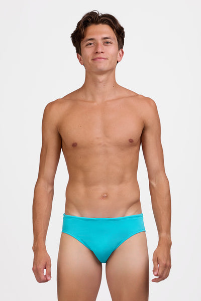 Male model wearing the Men's Brolyn Swim Brief in the Sky Blue solid, standing in front of a grey background shown from the front view

|| Size 32, Hips 39"  