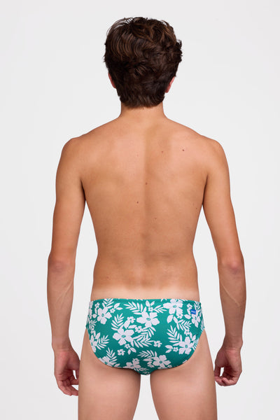 Male model wearing the Men's Brolyn Swim Brief in the Tropical Island print, standing in front of a grey background shown from the back view

|| Size 32, Hip 29"  