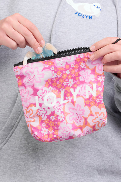 Up close image of the Dry Bag accessory in the Zinna print, in front of a grey background, shown from the front view