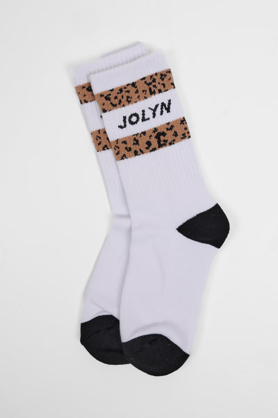Up close image of the Unisex crew socks in the Leopard Stripes print, in front  of a grey background, shown from the side view
