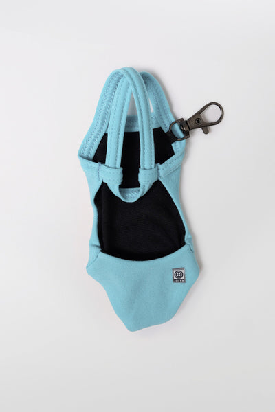 Flat Lay image of Mini Me Brandon Keychain in the Huckleberry Solid, in front of a grey background, shown from the back view