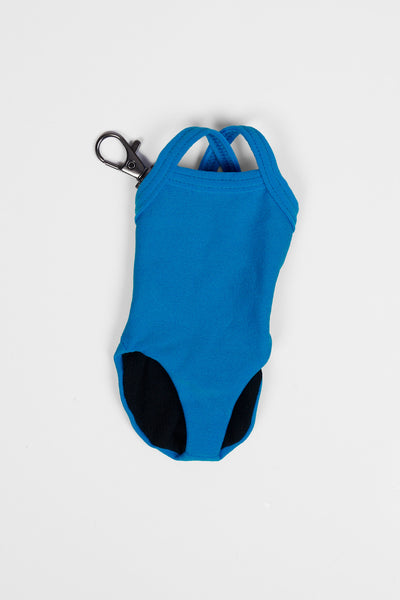 Flay lay image of the Mini Me Brandon Keychain in the Wavelett solid, shown from the front view