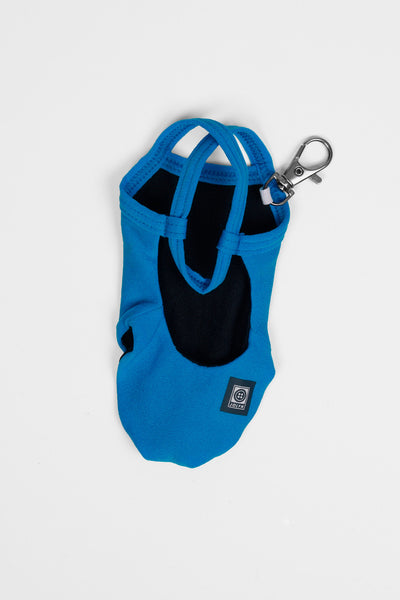 Flay lay image of the Mini Me Brandon Keychain in the Wavelett solid, shown from the back view