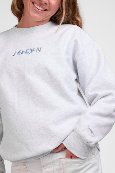 Female model wearing the Roxanne Sweatshirt in the Ash Shark Solid, standing in front of a grey background shown from the front view

|| Size S, Bust 36"  
