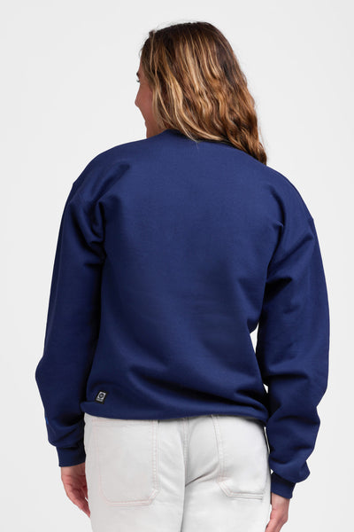 Female model wearing the Women's Roxanne Crewneck in the Navy Shark solid, standing in front of a grey background shown from the back view

|| Size S, Bust 36"  