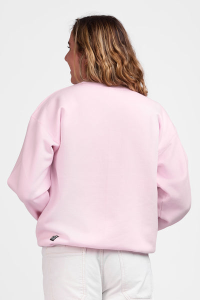 Female model wearing the Women's Roxanne Crewneck in the Pink Shark solid, standing in front of a grey background shown from the back view

|| Size S, Bust 36"  
