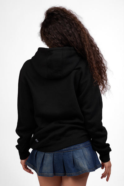 Female model wearing the Women's Raine Hoodie in the Bling solid, standing in front of a grey background shown from the back view

|| Size S, Bust 32"