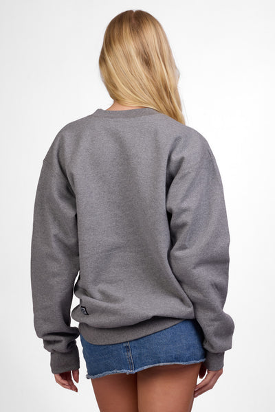 Female model wearing the Women's Roxanne Crewneck in the Fwends solid, standing in front of a grey background shown from the back view

|| Size S, Bust 32"