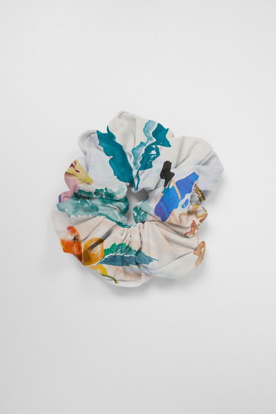 Flat Lay image of a Scrunchie in the Beach Day print, on top of a grey background, shown from the front view