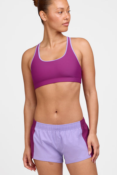 Female model wearing the Women's Rory Short in the Lilac Haze contrast, standing in front of a grey background shown from the front view 

|| Size M, Hip 38"