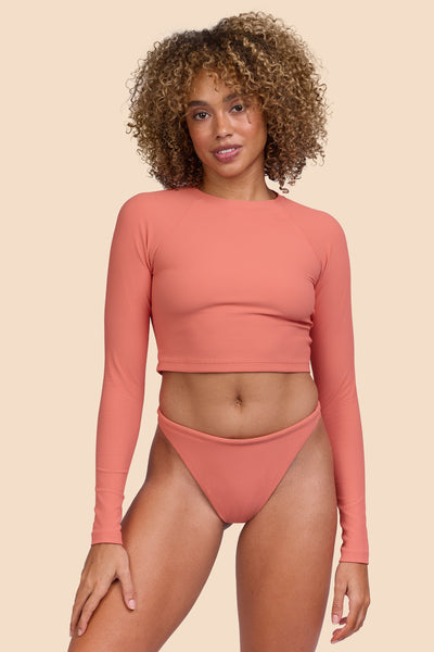 Female model wearing the Women's Ava Bikini Bottom in the Serrano Ribbed solid, standing in front of a yellow background, shown from the front view

|| Size S, Hip 36" 