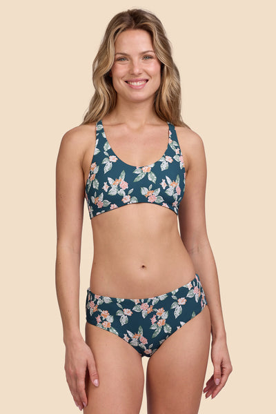 Female model wearing the Womens Dakota Bikini Bottom in the Islander Ribbed print, standing in front of a yellow background shown from the front view

|| Size S, Hip 36"  