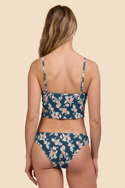 Female model wearing the Womens Gina Bikini Bottom in the Islander Ribbed print, standing in front of a yellow background shown from the back view

|| Size S, Hip 36"  