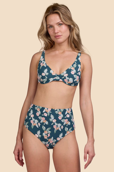 Female model wearing the Womens Janna Bikini Bottom in the Islander Ribbed print, standing in front of a yellow background shown from the front view

|| Size S, Hip 36"  