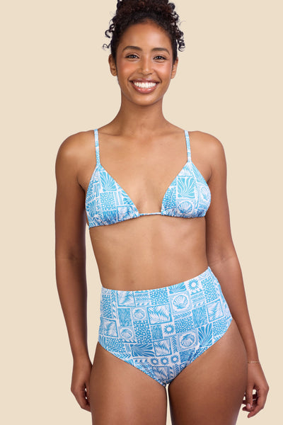 Female model wearing the Women's Janna Bikini Bottom in the Swell print, standing in front of a yellow background shown from the front view

|| Size S, Hips 37" 