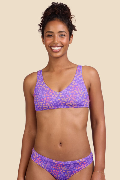 Female model wearing the Women's Kacey Bikini Top in the Jellybean print, standing in front of a yellow background shown from the front view

|| Size S, Bust 32"
