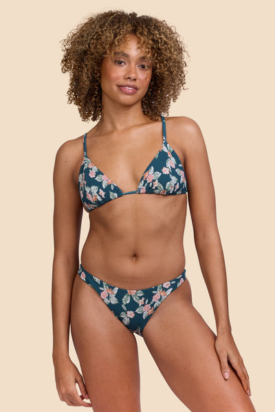 Female model wearing the Womens Kelia Bikini Bottom in the Islander Ribbed print, standing in front of a yellow background shown from the front view

|| Size S, Hip 36"  