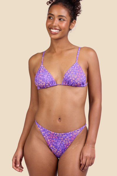 Female model wearing the Women's Odessa Bikini Bottom in the Jellybean print, standing in front of a yellow background shown from the front view

|| Size S, Hips 37"