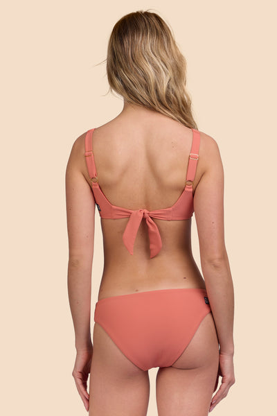 Female model wearing the Women's Valle Bikini Bottom in the Serrano Ribbed solid, standing in front of a yellow background, shown from the back view

|| Size S, Hip 36" 