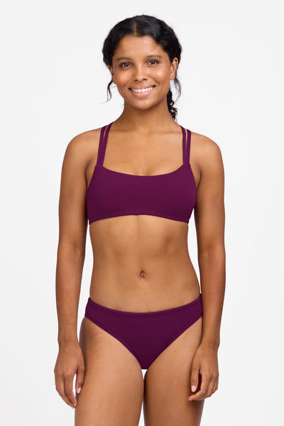 Female model wearing the Women's Andy Bikini Bottom in the Cabernet solid, standing in front of a grey background shown from the front view

|| Size S, Hips 36.5"