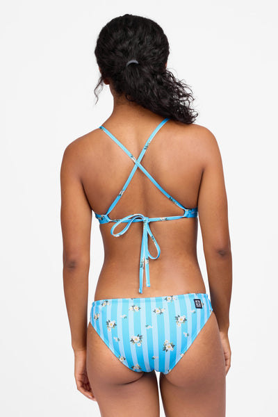 Female model wearing the Women's Andy Bikini Bottom in the Harbor Bloom print, standing in front of a grey background shown from the back view 

|| Size S, Hip 36.5"