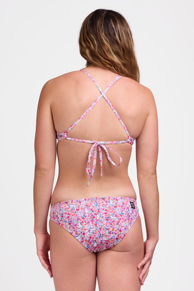 Female model wearing the Women's Andy Bikini Bottom in the Hop Hop print, standing in front of a grey background shown from the back view

|| Size M, Bust 36"  