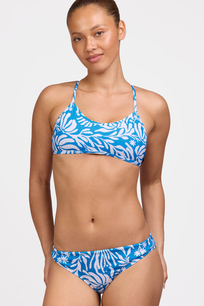 Female model wearing the Women's Andy Bikini Bottom in the Tidepool print, standing in front of a grey background shown from the front view

|| Size M, Hip 38"  