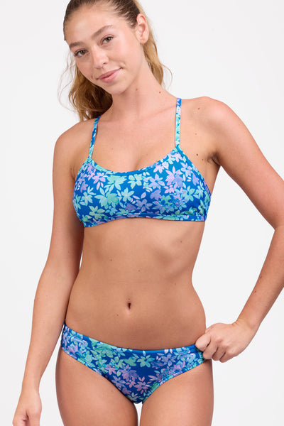 Female model wearing the Women's Andy Bikini Bottom in the Waterlily print, standing in front of a grey background shown from the front view

|| Size S, Hip 34" 