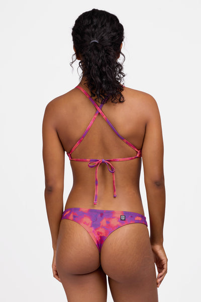 Female model wearing the Women's Dreya Bikini Bottom in the Canvas print, standing in front of a grey background shown from the back view

|| Size S, Hip 36.5"  
