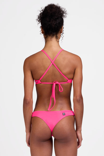 Female model wearing the Women's Dreya Bikini Bottom in the Pink Prism solid, standing in front of a grey background shown from the back view

|| Size S, Hip 34.5"  