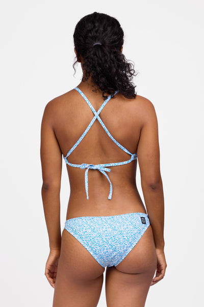Female model wearing the Women's Europe Bikini Bottom in the Dreamweave print, standing in front of a grey background shown from the back view

|| Size S, Hip 36.5"  