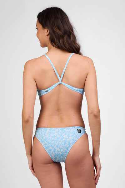 Female model wearing the Women's Europe Bikini Bottom in the Gleam print, standing in front of a grey background shown from the back view

|| Size S, Hips 36 1/2"