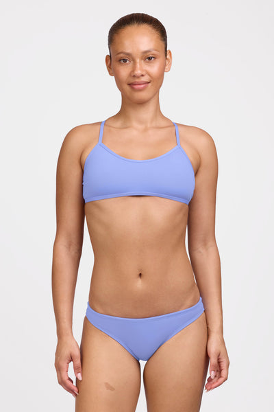 Female model wearing the Women's Midl Bikini Bottom in the Lavender solid, standing in front of a grey background shown from the front view

|| Size M, Hips 38"