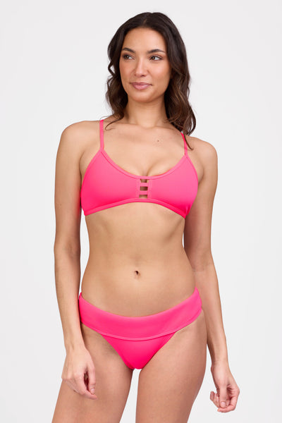 Female model wearing the Women's Softy Bikini Bottom in the Hot Pink solid, standing in front of a grey background shown from the front view

|| Size S, Hips 36 1/2"  
