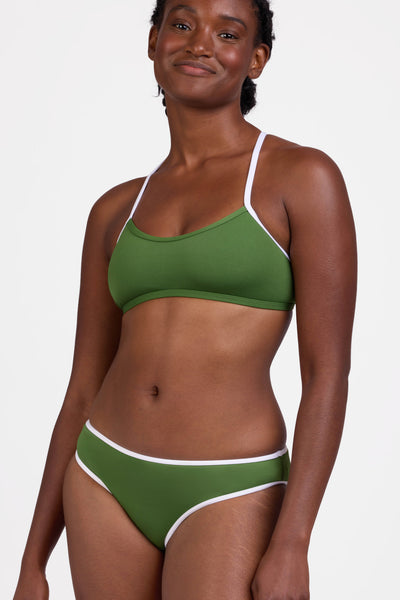 Male model wearing the Women's Whitney Bikini Bottom in the Mountain Mist contrast, standing in front of a grey background, shown from the front view

|| Size M, Hips 35"  