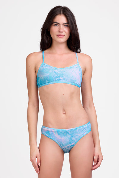 Female model wearing the Women's Whitney Bikini Bottom in the Odyssey print, standing in front of a grey background shown from the front view

|| Size S, Hips 35"  