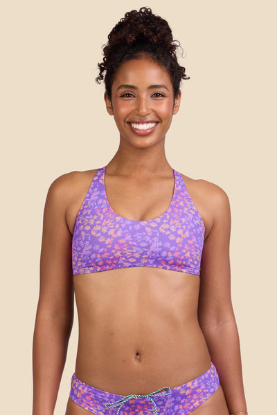 Female model wearing the Women's Blake Bikini Top in the Jellybean print, standing in front of a yellow background shown from the front view

|| Size S, Bust 32"