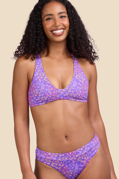 Female model wearing the Women's Doris Bikini Top in the Jellybean print, standing in front of a yellow background shown from the front view

|| Size S, Bust 32"