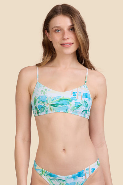 Female model wearing the Women's Eryn Bikini Top in the Cocopalm print, standing in front of a yellow background shown from the front view

|| Size S, Bust 30.5"  
