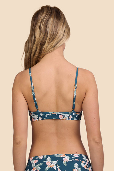 Female model wearing the Women's Eryn Bikini Top in the Islander Ribbed print, standing in front of a yellow background, shown from the back view

|| Size S, Bust 33"  