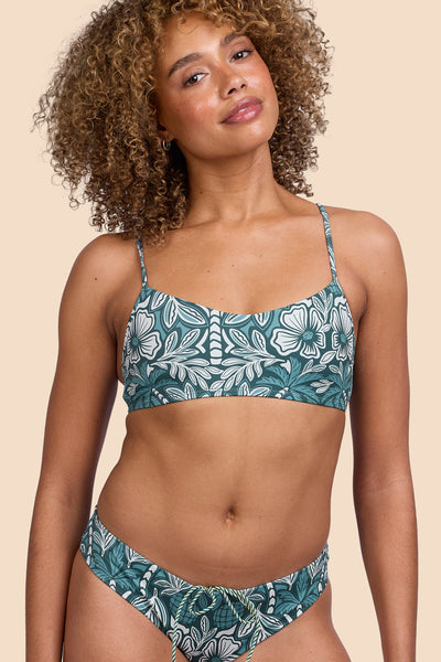 Female model wearing the Womens Eryn Bikini Top in the Shorebreak print, standing in front of a yellow background shown from the front view

|| Size S, Bust 32.5"  