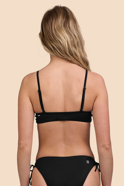 Female model wearing the Womens Faye Bikini Top in the Black solid, standing in front of a yellow background shown from the back view

|| Size S, Bust 33"  