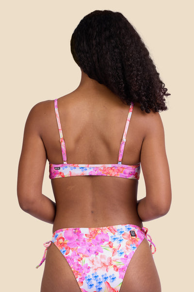 Female model wearing the Women's Faye Bikini Top in the Orchids ribbed print, standing in front of a yellow background shown from the back view

|| Size S, Bust 32" 