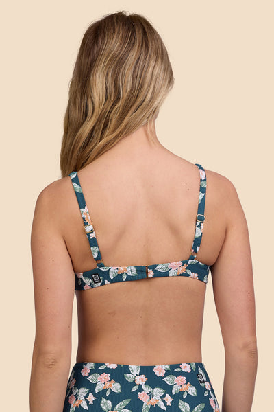 Female model wearing the Women's Hadley Bikini Top in the Islander Ribbed print, standing in front of a yellow background, shown from the back view

|| Size S, Bust 33"  