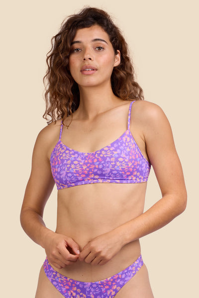 Female model wearing the Women's Hikari Bikini Top in the Jellybean print, standing in front of a yellow background shown from the front view

|| Size S, Bust 35.5"