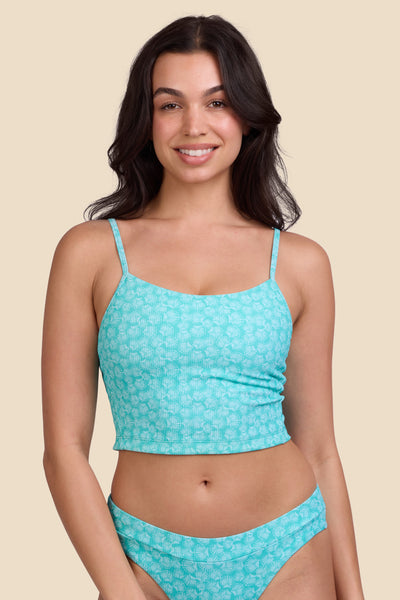 Female model wearing the Women's Luca Bikini Top in the Clamshell Ribbed print, standing in front of a yellow background shown from the front view

|| Size M, Bust 32"  

