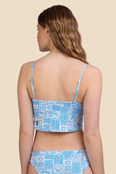 Female model wearing the Women's in the Luca Tankini Top in the Swell print, standing in front of a yellow background shown from the back view

|| Size S, Bust 30.5"