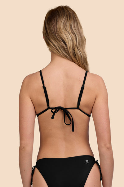 Female model wearing the Womens Margie Bikini Top in the Black solid, standing in front of a yellow background shown from the back view

|| Size S, Bust 33"  