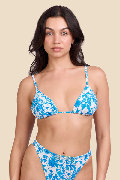 Female model wearing the Women's Margie Bikini Top in the Bluefin print, standing in front of a yellow background shown from the front view

|| Size M, Bust 32"  

